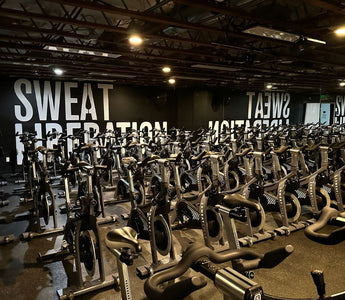 Indoor cycling studio with multiple Stages indoor bikes arranged for group fitness classes