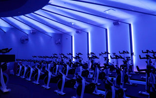 Indoor cycling studio with multiple Stages indoor bikes arranged for group fitness classes