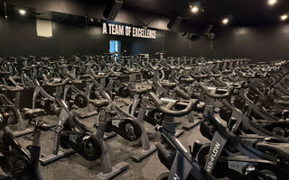 POWER+FLOW spin studio in Scottsdale Arizona with rows of commercial indoor cycling bikes used for group fitness classes
