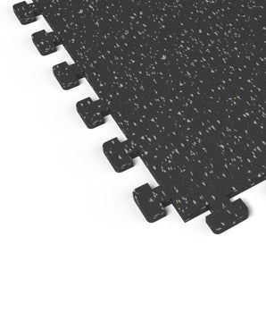 Close-up of the puzzle-edge interlock on a Gray Hound REGUPOL aktivlok rubber gym tile showing gray flecks on a black base