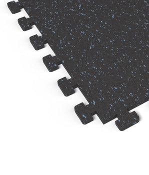 Close-up of the puzzle-edge interlock on a Jayz Blue REGUPOL aktivlok rubber gym tile showing blue flecks on a black base