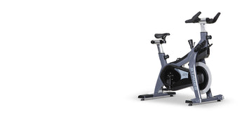 Stages SC2 indoor cycling bike with RhythmBar handlebar, three-quarter side view on white background