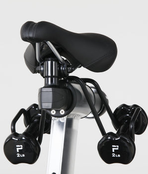 Patented Stages Weight Holder under saddle holding two 2 lb dumbbells